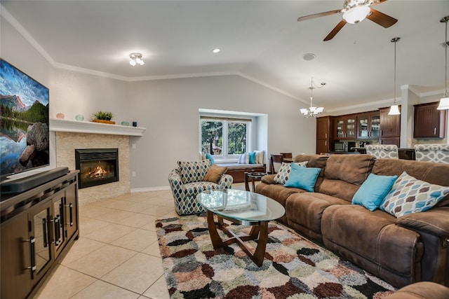 tiled living room with ceiling fan with notable chandelier, crown molding, and lofted ceiling