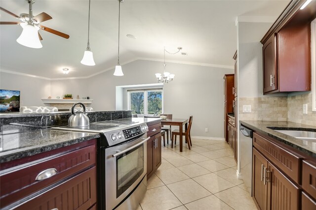 kitchen with vaulted ceiling, ceiling fan with notable chandelier, stainless steel appliances, crown molding, and decorative light fixtures