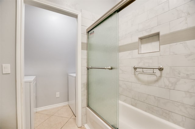 bathroom featuring bath / shower combo with glass door and tile patterned floors