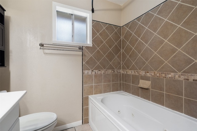 bathroom with vanity, a bathtub, toilet, and tile patterned floors