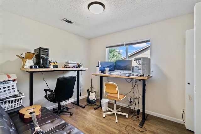 office with a textured ceiling and hardwood / wood-style floors