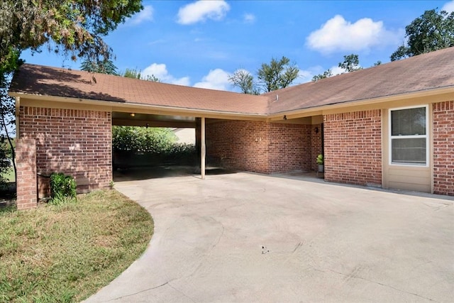 exterior space with a carport