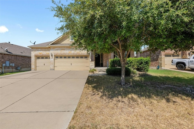 view of front of house with a front lawn and a garage