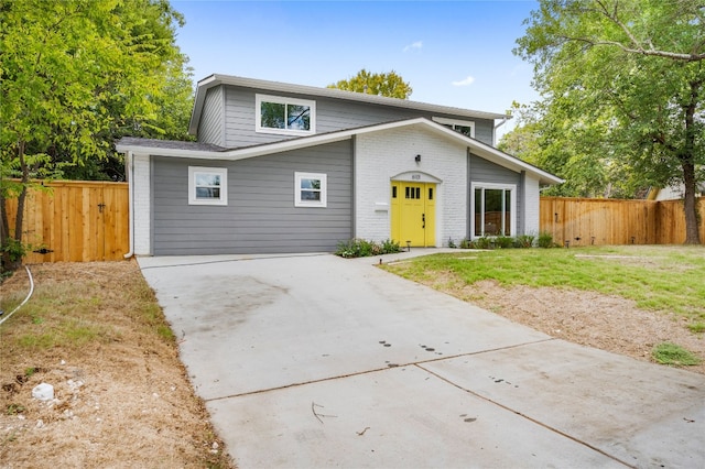 front facade with a front yard