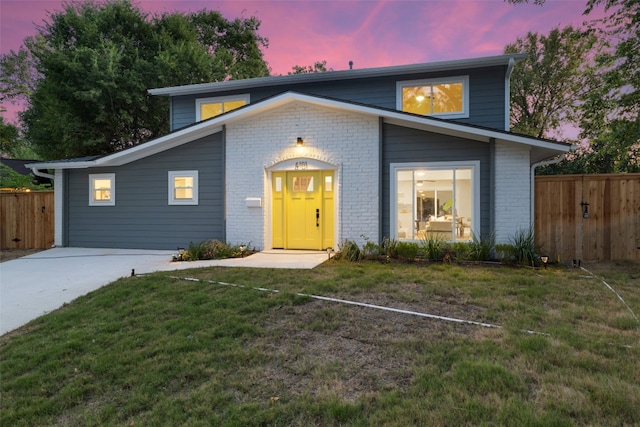 front facade with a lawn