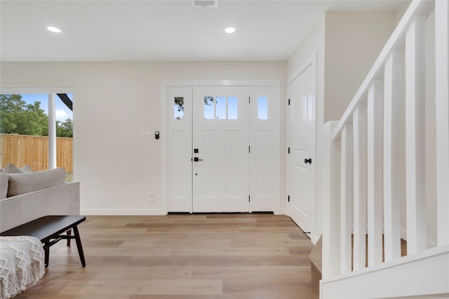 entryway with light hardwood / wood-style flooring