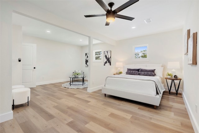 bedroom featuring light wood-type flooring and ceiling fan