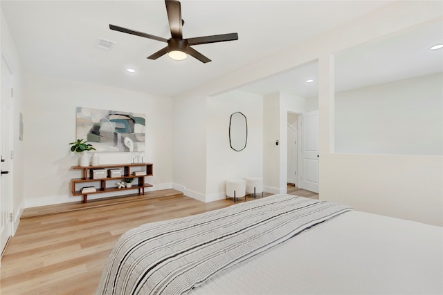 bedroom with wood-type flooring and ceiling fan