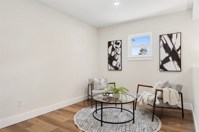 sitting room featuring hardwood / wood-style flooring