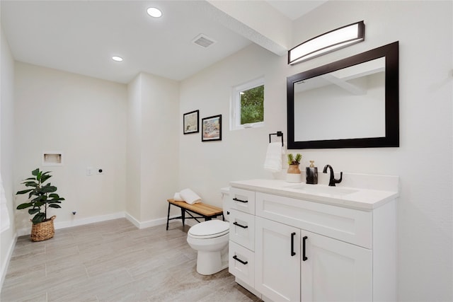 bathroom with vanity and toilet