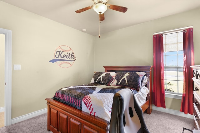 bedroom with ceiling fan and light carpet