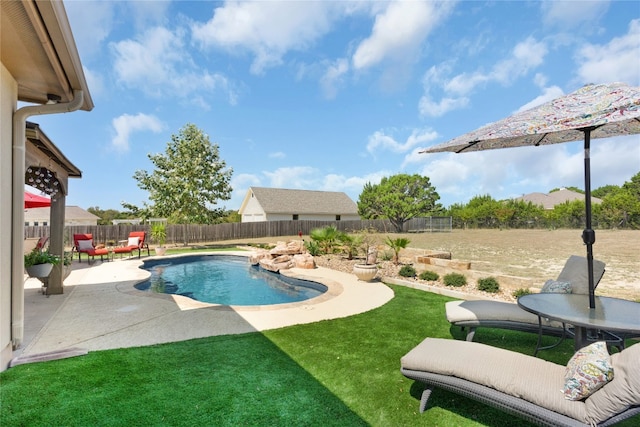 view of pool with a yard and a patio area