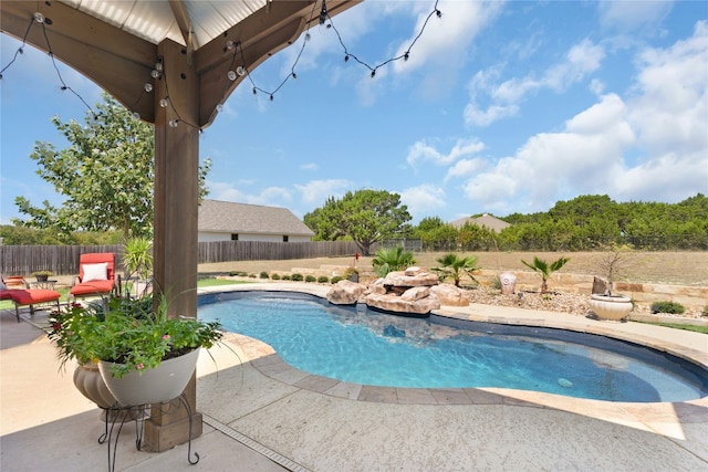 view of swimming pool featuring a patio area