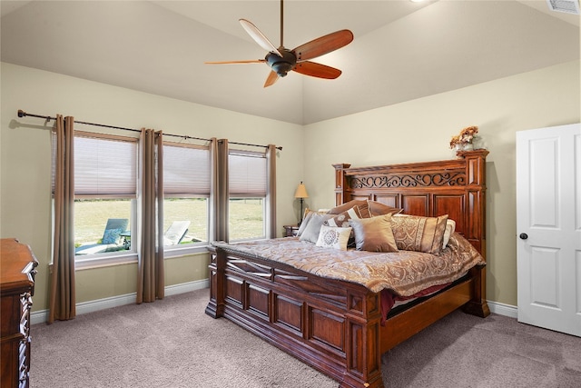 bedroom with light colored carpet, ceiling fan, and lofted ceiling