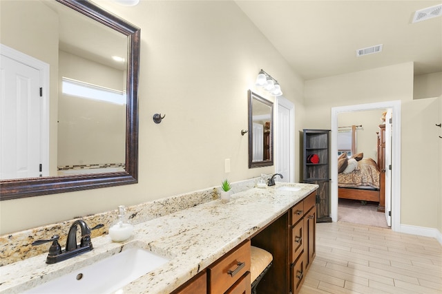 bathroom featuring hardwood / wood-style floors and vanity