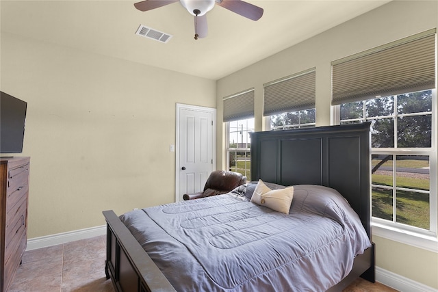 bedroom featuring ceiling fan and light tile patterned flooring