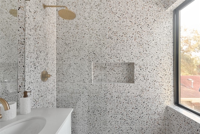 bathroom featuring sink and tiled shower