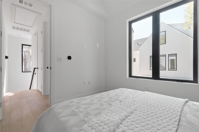 bedroom with light hardwood / wood-style floors