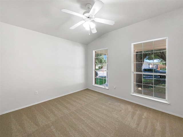 unfurnished room featuring vaulted ceiling, ceiling fan, and carpet floors