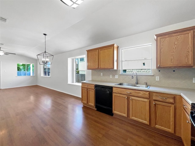 kitchen featuring sink, dishwasher, dark hardwood / wood-style floors, ceiling fan with notable chandelier, and vaulted ceiling