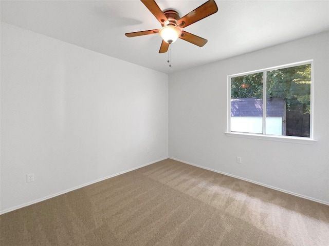 carpeted empty room with ceiling fan