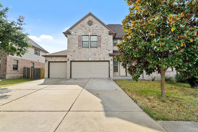 view of front facade with a front yard and a garage