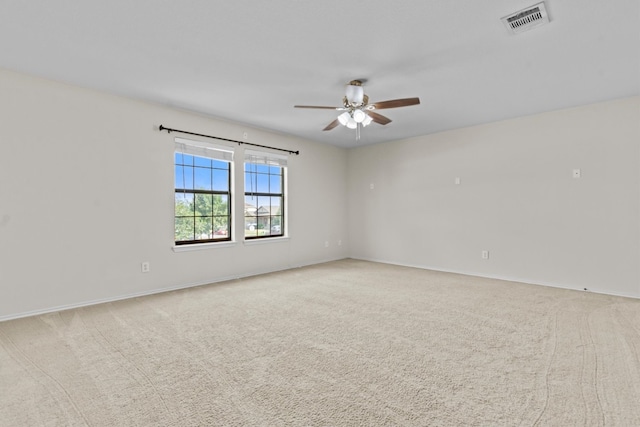 empty room with light carpet and ceiling fan