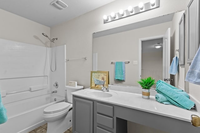 full bathroom with tile patterned flooring, toilet, vanity, and washtub / shower combination