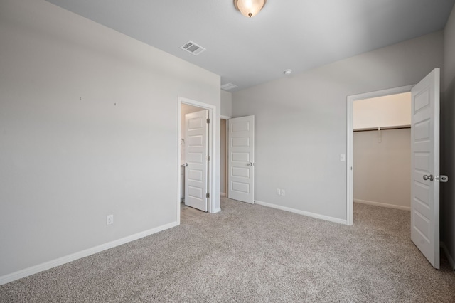 112 Driftwood Hills Way, Georgetown, TX 78633 - unfurnished bedroom featuring a spacious closet, carpet, baseboards, and a closet