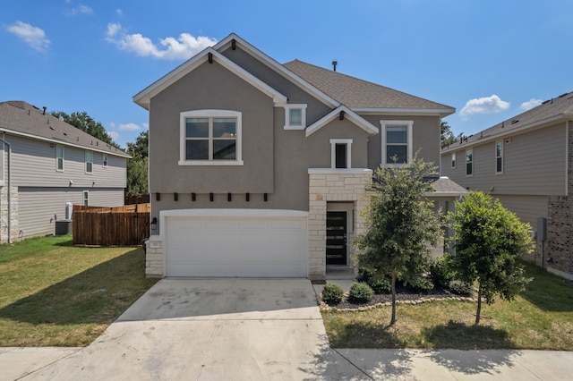 front of property featuring a front lawn and a garage