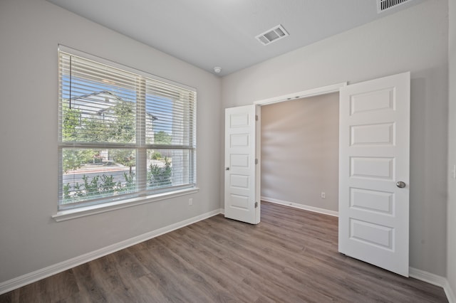 unfurnished bedroom featuring wood-type flooring