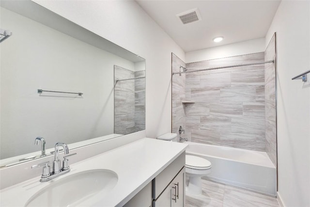 bathroom featuring visible vents, toilet,  shower combination, and vanity