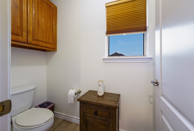 bathroom featuring toilet and tile patterned floors