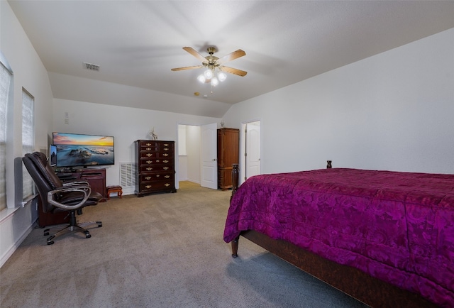 bedroom with lofted ceiling, light carpet, and ceiling fan