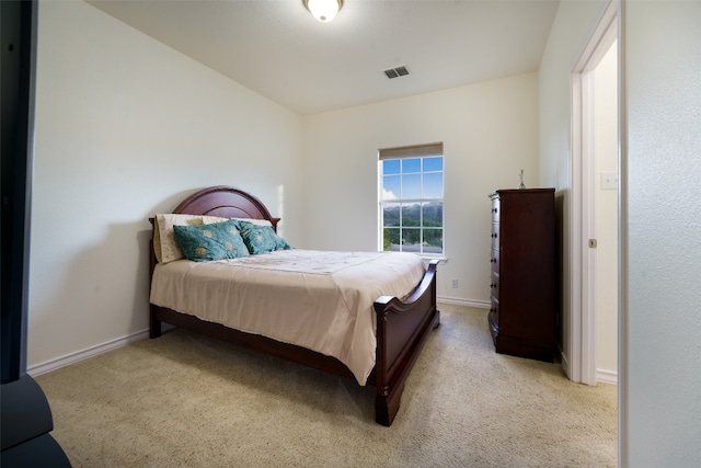 bedroom featuring light carpet