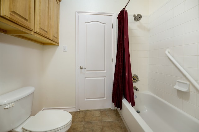 bathroom featuring shower / bath combination with curtain, tile patterned flooring, and toilet