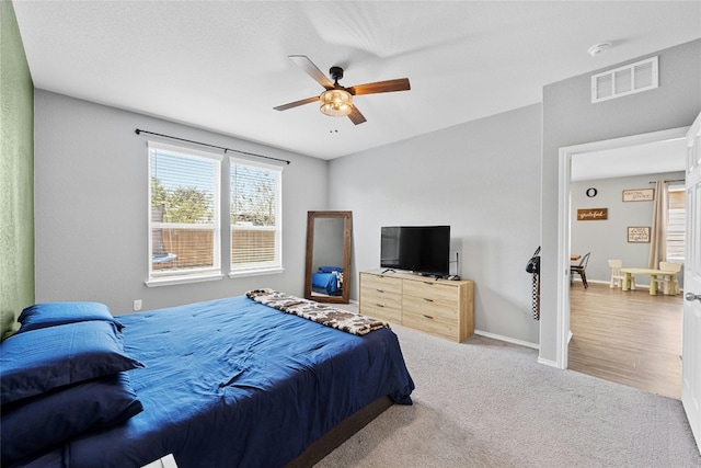 carpeted bedroom featuring ceiling fan