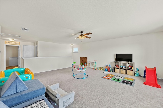 recreation room featuring carpet floors and ceiling fan