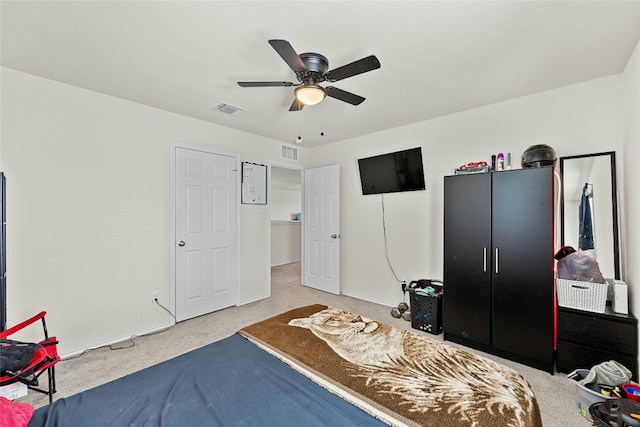 bedroom with ceiling fan and carpet flooring