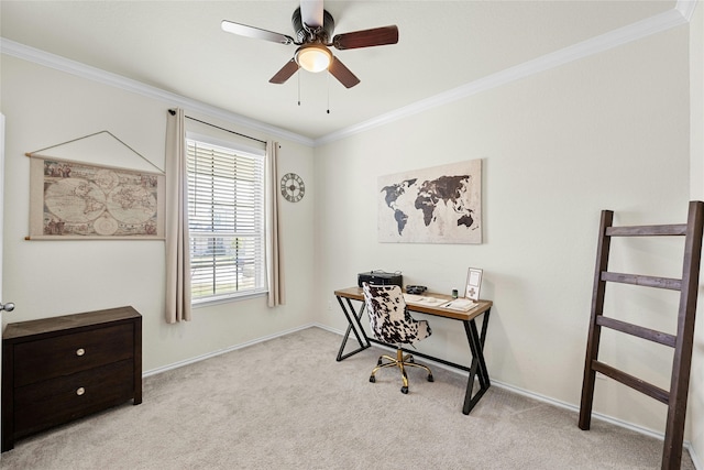 carpeted home office featuring ceiling fan and crown molding