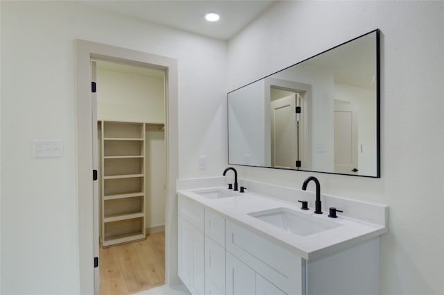 bathroom featuring vanity and hardwood / wood-style flooring