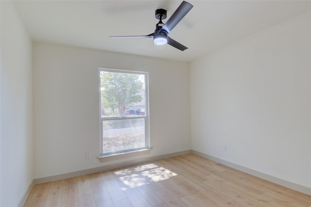 unfurnished room with ceiling fan and light wood-type flooring