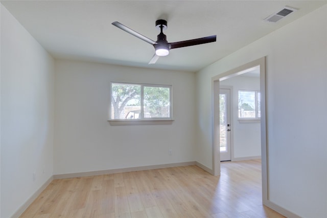 empty room featuring ceiling fan and light wood-type flooring