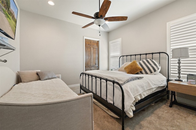 carpeted bedroom with ceiling fan