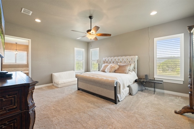 carpeted bedroom featuring ceiling fan