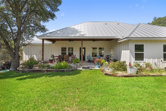 back of house with a lawn, ceiling fan, and a patio area