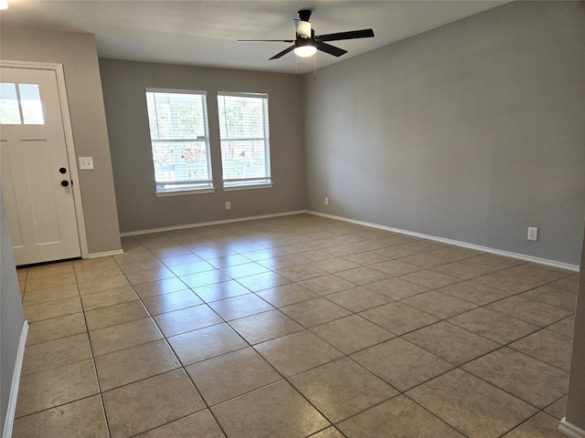 tiled foyer with ceiling fan and a wealth of natural light