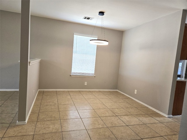 unfurnished dining area featuring light tile patterned floors