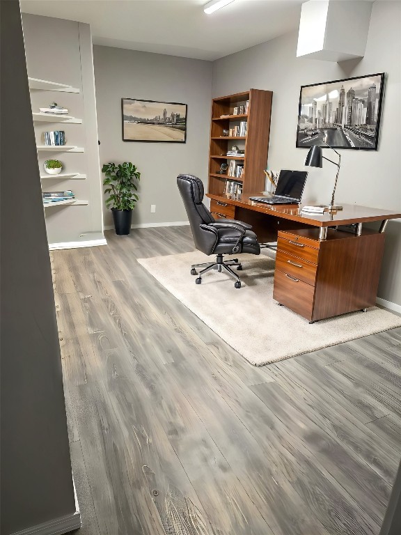 home office with hardwood / wood-style flooring