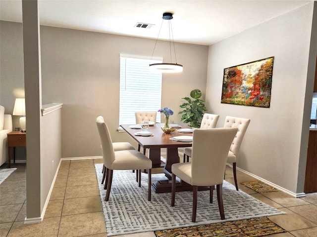 dining space with tile patterned flooring